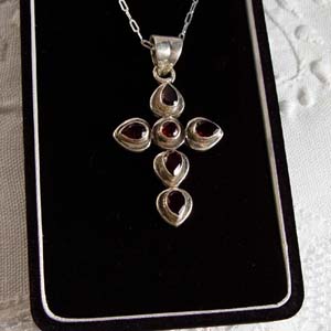 Faceted garnet  and sterling silver cross
