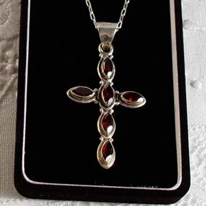 Faceted garnet  and sterling silver cross